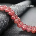 Macro detail of natural translucent pink strawberry quartz beads with fine inclusions - Strawberry Quartz
