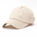Distressed beige cotton baseball cap with vintage worn holes and frayed details for a retro look - Off White