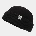 Gedetailleerde gebreide textuur van zwarte vintage docker muts met wit merklabel - M (56-58cm) / Zwart
