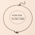 Black bird pendant necklace in 18K gold plated steel with sparkling diamond accents - Black