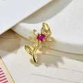 Macro detail of gold sunflower pendant with rose red zircon and crystal petals - Rose Red