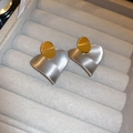 Detail of mixed-tone earrings featuring gold studs and large brushed silver hearts - No. 62 Silver Needle Earrings - Real Gold Plated - Regular - Silver & Gold Heart