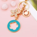 Floral gold-plated metal keychain with sparkling rhinestone flower and blue enamel ring - Blue Five-leaf Clover