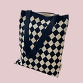 Detail of checkered knit pattern texture in black and beige on a shoulder tote bag - Black Argyle