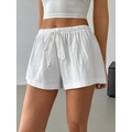 Dettaglio degli shorts bianchi in cotone e lino con vita elastica e coulisse regolabile - XS / Bianco