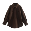 Detailed macro view of deep brown wool-style jacket with large pockets and flat lay texture - Coffee