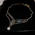 Elegant silver tassel necklace with rhinestones and large round pearl pendant - Gold
