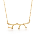 Golden titanium steel zodiac necklace with crystal constellation pendant on white background - Sagittarius