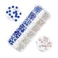 Detailed macro view of 12-grid box containing blue and AB crystal flatback nail art rhinestones - AB & Royal Blue (A1039-11)