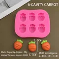 Macro detail of a 6-cavity pink silicone mold and carrot-shaped resin cake decorations - Mini Carrot / Pink