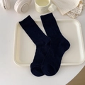 Dark navy mid-calf cotton socks with ribbed knit texture in a minimalist setup - One Size / Navy Blue