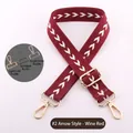 Detail of adjustable burgundy woven strap with white arrow pattern and triple hardware options - Light Gold Buckle / Burgundy