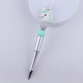 Detail of DIY beaded pen featuring a white unicorn topper and green silicone beads - Green Unicorn