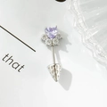 Silver cat paw piercing stud with purple heart gemstone and strawberry dangle detail - Purple