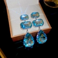 Eleganti orecchini pendenti con cristallo blu mare e montatura in argento lucido - Perno in argento-Blu