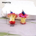Detailed view of mushroom-shaped apple core pendants with red-yellow gradient resin finish - Colorful Red Apple Core