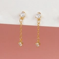 Detail of elegant gold drop earrings with chains and sparkling round clear crystals - Simple Zirconia Chain Drop Earrings