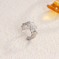 Adjustable silver daisy open ring in stainless steel with minimalist floral design - Continuous Flower / Steel