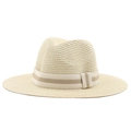 Detailed view of beige straw hat featuring striped ribbon band and tight woven texture - Beige