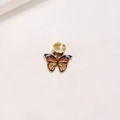 Détail d'un anneau de cheveux doré avec un pendentif papillon orange et noir détaillé - Papillon Unique / 1 Pièce / Marron