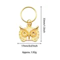 Detailed view of a golden owl pendant with precise height and width measurements - Owl