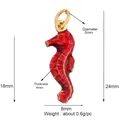 Macro detail of red enamel seahorse charm with golden metal edges and size dimensions - Red Seahorse