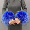 Close-up of blue faux fur wrist cuffs with fluffy texture and dark tips on a model - Royal Blue Jacquard