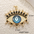 Macro shot of gold Evil Eye pendant showing 3.7cm size and 7g weight specifications - A0245