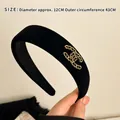 Padded black velvet headband featuring a golden chain CC logo design for elegant styling - Chanel Chain Double C Style / Black