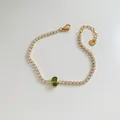 Gold tennis bracelet featuring an oval green zircon stone and a secure lobster clasp - Gold/Olive Green Zircon (SBK417)