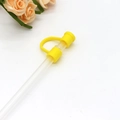 Reusable yellow silicone straw cover with dust-proof plug on a transparent straw - Dark Yellow