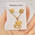 Detail of gold heart 'I YOU' necklace and earrings set on stainless steel display card - I LOVE YOU Heart / Gold