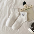 White cotton sports socks with panda embroidery and ribbed cuffs on white fabric background - Back Panda-White