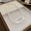 French vintage pearl necklace with golden clasp displayed on a linen jewelry tray - 7# Necklace-White-6mm