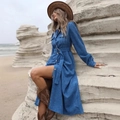 Detailed view of blue corduroy shirt dress with metal buttons and slit hemline - S / Blue