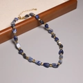 2mm rainbow tourmaline necklace featuring blue and white beads with gold spacers - XL0064 Blue White Sodalite Irregular