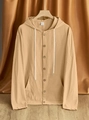 Detailed shot of beige linen blend hooded shirt featuring drawstring and front pocket - Earthy Yellow