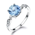 Elegant 925 sterling silver ring featuring a round blue gemstone and white side stones - Size 5 / Round Blue Gemstone Style (RUJ016B-1)