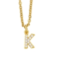 Detailed view of golden letter K pendant with sparkling white zircons on a fine chain - Letter K / Gold