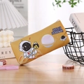 Close-up of yellow astronaut pencil case with Space Dreams theme on a wooden desk - Starry Trip Astronaut