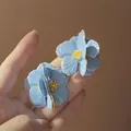 Macro detail of blue floral earrings with golden stamens and glossy petal finish - 37# Silver Earring Post - Blue