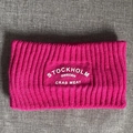 Detail of rose purple ribbed knit headband with white Stockholm Sweden embroidery - Rose Red