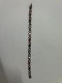 Detail of magnetic heart link bracelet featuring inlaid red black and white decorative stones - Black Red White Magnet / Bronze