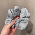 Elegant silver-grey oversized scrunchie with metallic luster and pleated fabric texture - Gray