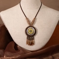 Detailed close-up of a bohemian long necklace with wooden beads and mandala pendant - X445-4 Style 5