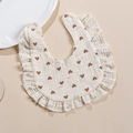 Muslin cotton baby bib with ruffles and heart print featuring adjustable snap buttons - Heart