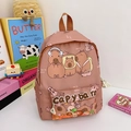 Lotus pink children's backpack featuring cute capybara prints and large capacity - Brown