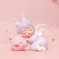 Resin ornament featuring a purple haired angel girl sleeping on a pink pig, 8.5x6x8.5cm - 1121-5 Piglet Purple
