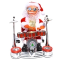 Electric Santa Claus figure playing red drum set with Merry Christmas text on front - Drumming Stage Santa