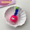 Cute fuzzy monster hair clip with big eyes and blue spring on a white shell tray - Rose Red / Rose Red Plush Hair Clip